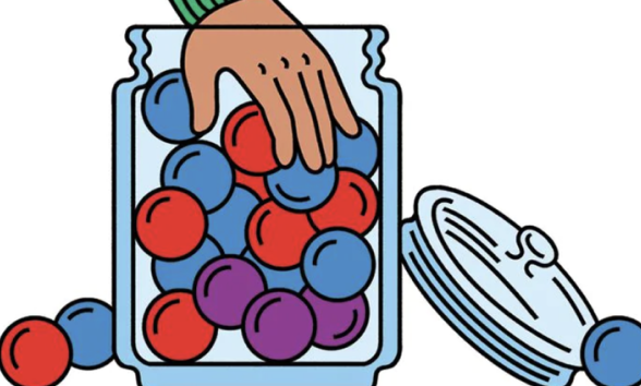 Hand reaching into a bucket of bingo balls